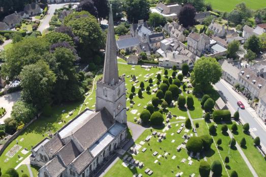 A bird's eye view of Painswick St Mary Church and its churchyard