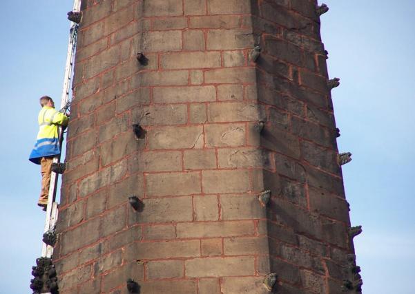a steeplejack on a church spire