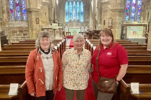 Sarah Crossland, the National Churches Trust's Engagement Manager (right) at the Church of the Ascension in Whixley, Yorkshire, with Revd Joan Roper and Churchwarden and gorgeous cake maker Enid Fisher (centre)