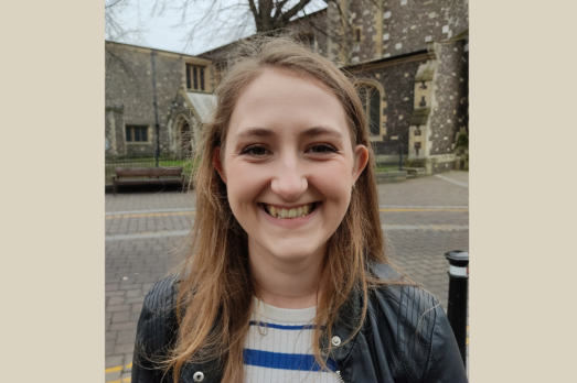 A photograph of a person outside a church