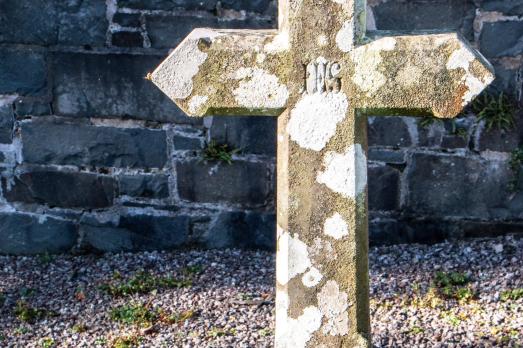 A stone cross gravestone