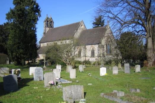 Image of the outside and graveyard of Holy Trinity church. 