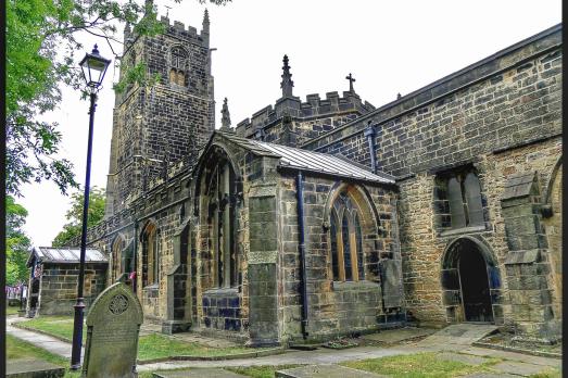 A dark grey stone church