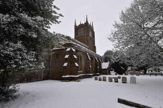 A photo of the stone church in the snow