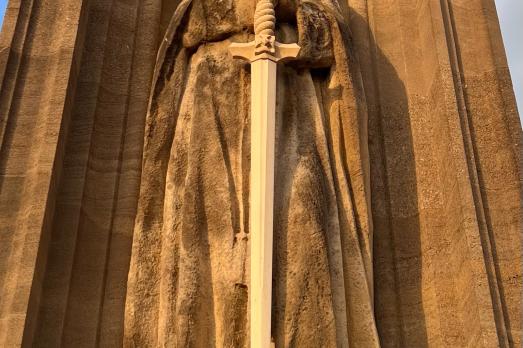 Image of person stone carving