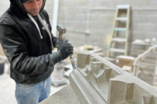 Image of person conducting stone carving