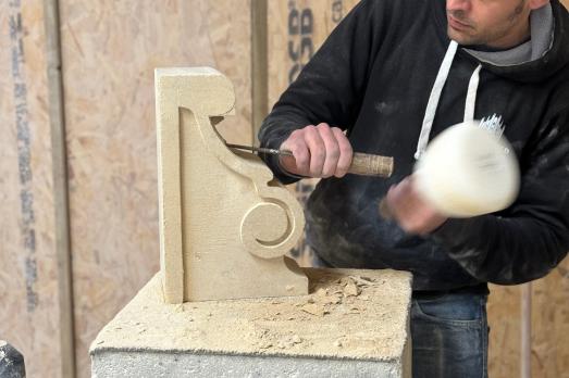 Image of person conducting stone carving