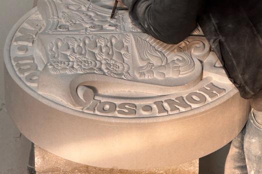 Image of person conducting stone carving