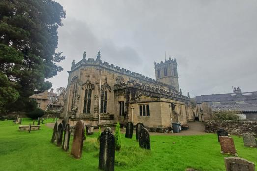 A photo of the impressive St Margaret stone church taken from the back of the graveyard