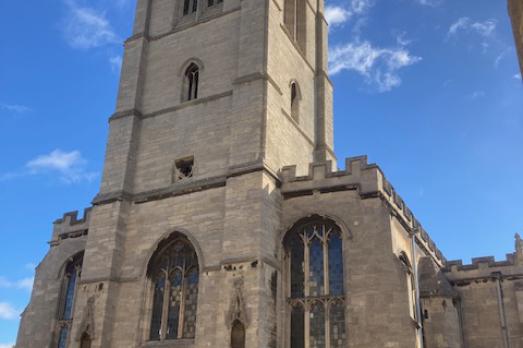 Exterior of Stamford St Martin; the central tower dominates the image.