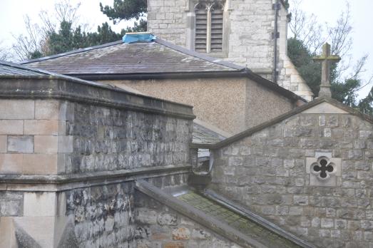 A close up of the different roofs on the church