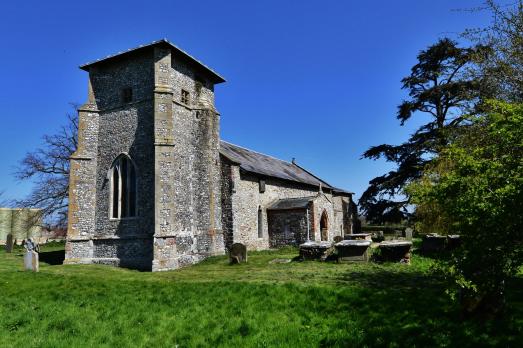 A unique 14th century grey stone church with a distinctive tower.