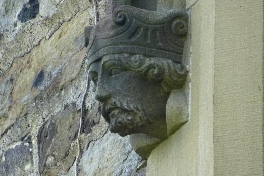 A stone head with a crown
