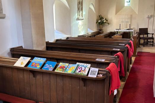 Rows of wooden pews inside the church