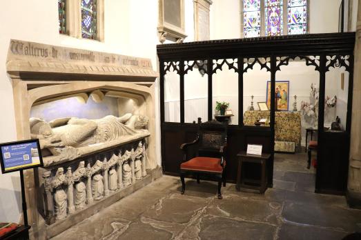 A stone monument inside the church