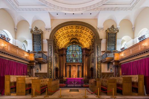 The bright interior of St Alfrege; filled with rich wood and reds and golds