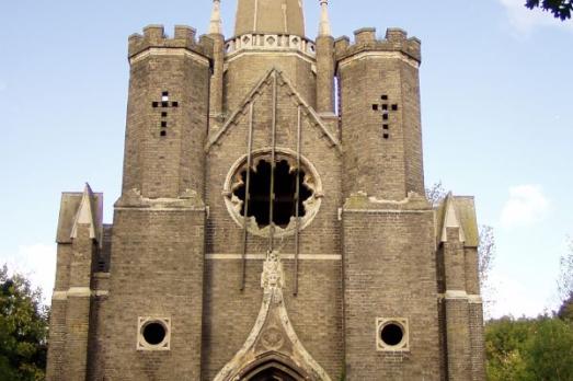 The striking stone exterior of Abney Park Chapel with multiple turrets