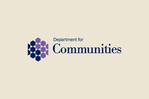 The logo of the Department For Communities NI