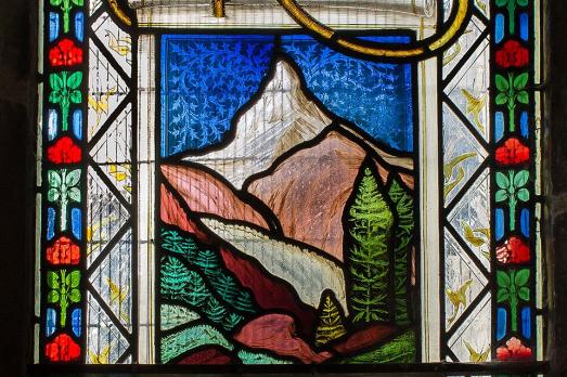 A close up of a memorial stained glass window
