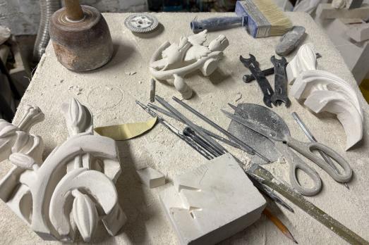 Pieces of stone on a table with stonework tools