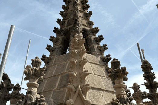 A church tower with the sky in the background