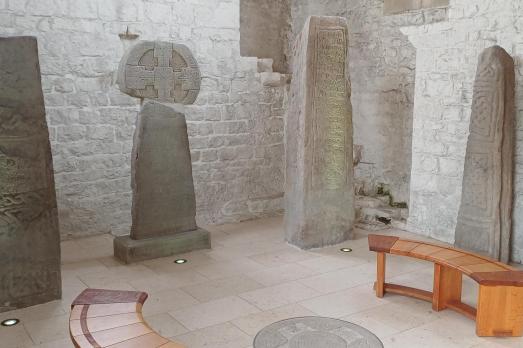 Two wooden benches are set up to view the Celtic standing stones