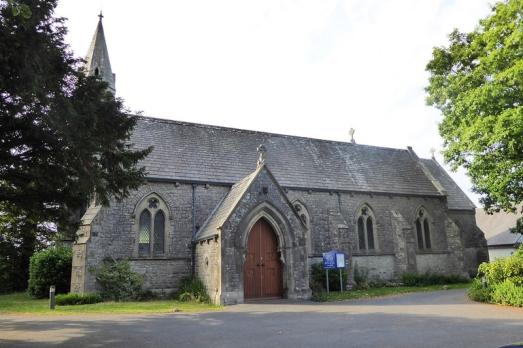 A landscape shot of St Mary with a protruding porchway. 