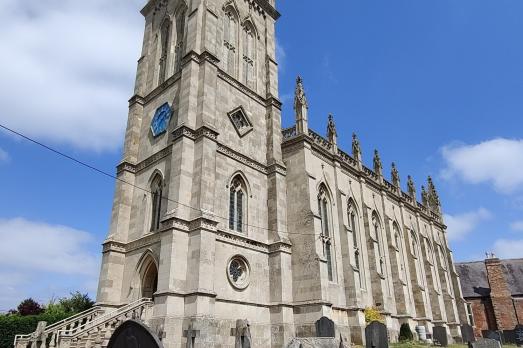 A striking and impressive stone church with a prominent tower