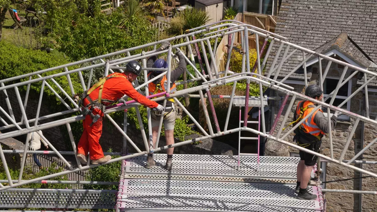 St Just in Penwith church with men on scaffold