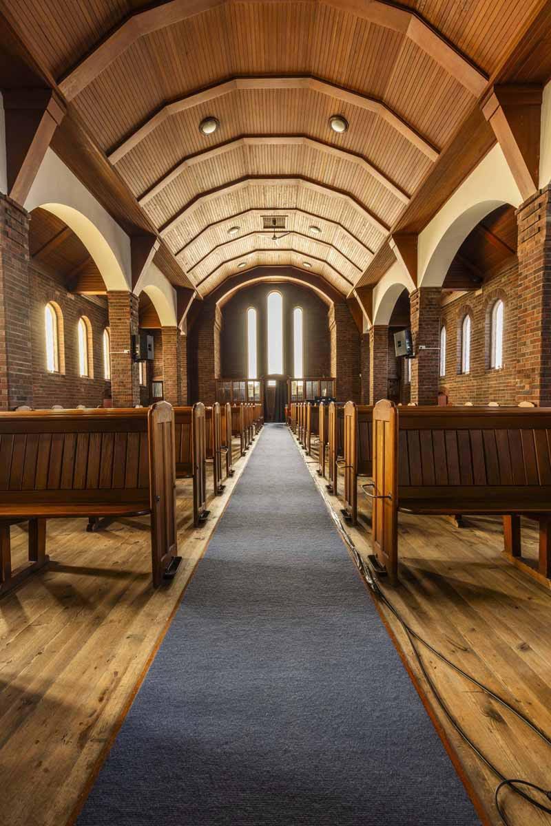An interior photograph of the aisle inside RCCG Church, Edinburgh
