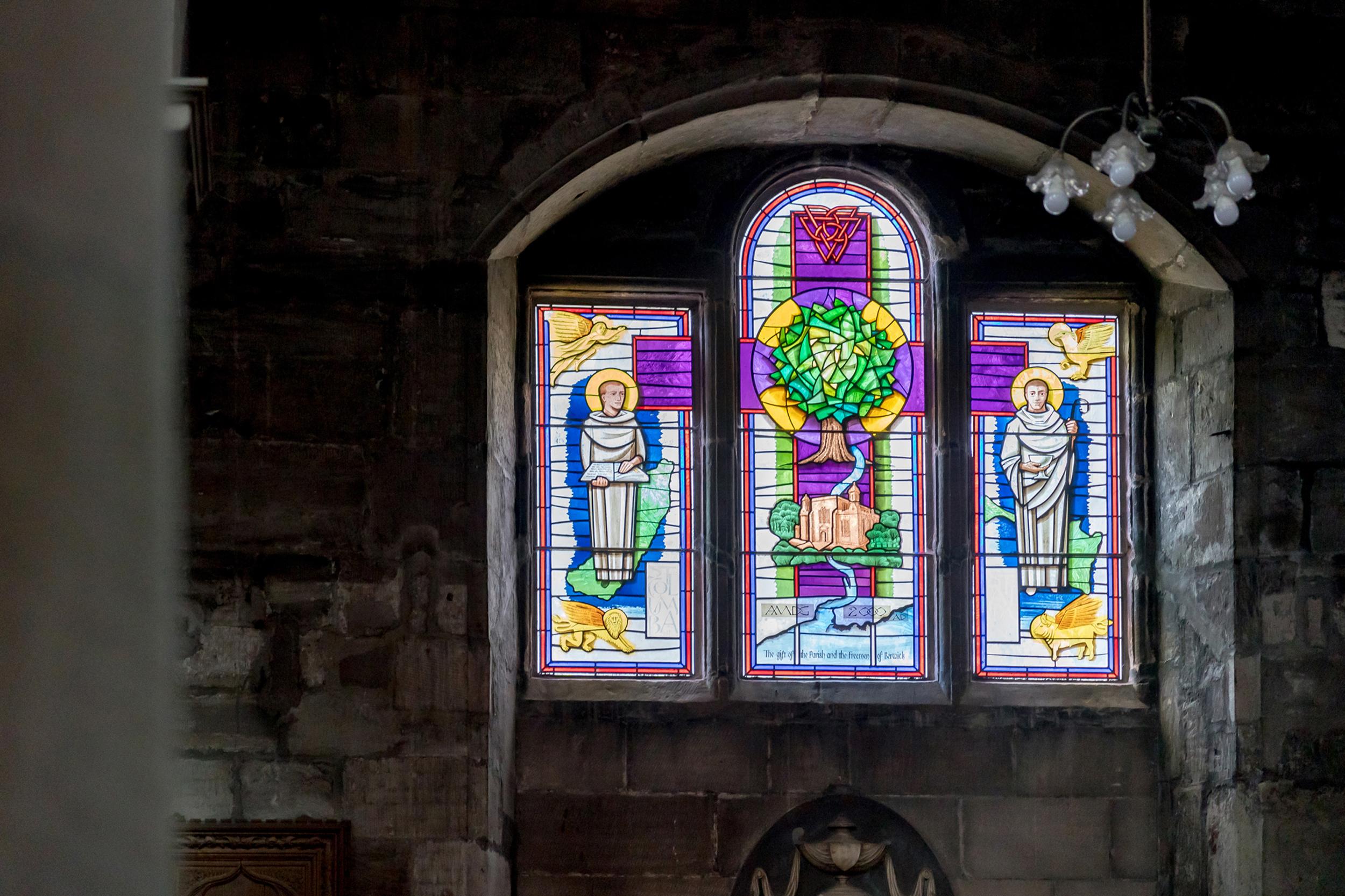 A purple and green stained glass window