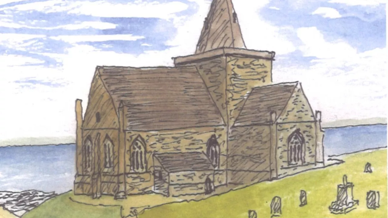 A grey church behind a graveyard