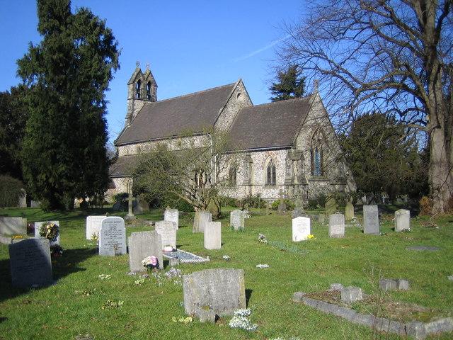 Image of the outside and graveyard of Holy Trinity church. 