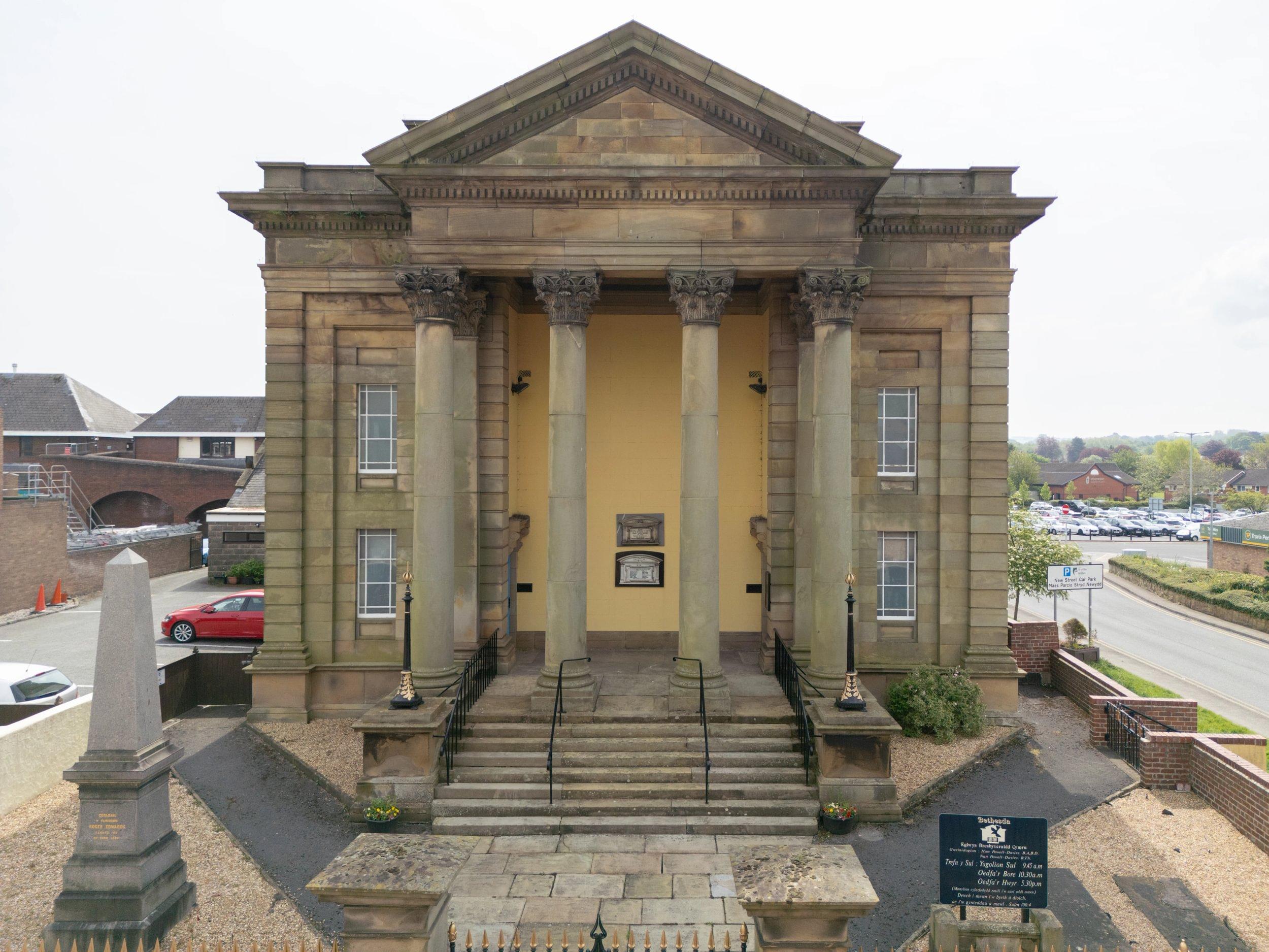 The outside of Bethesda Presbyterian Chapel in Mold, Flintshire. It has beautiful stone columns.