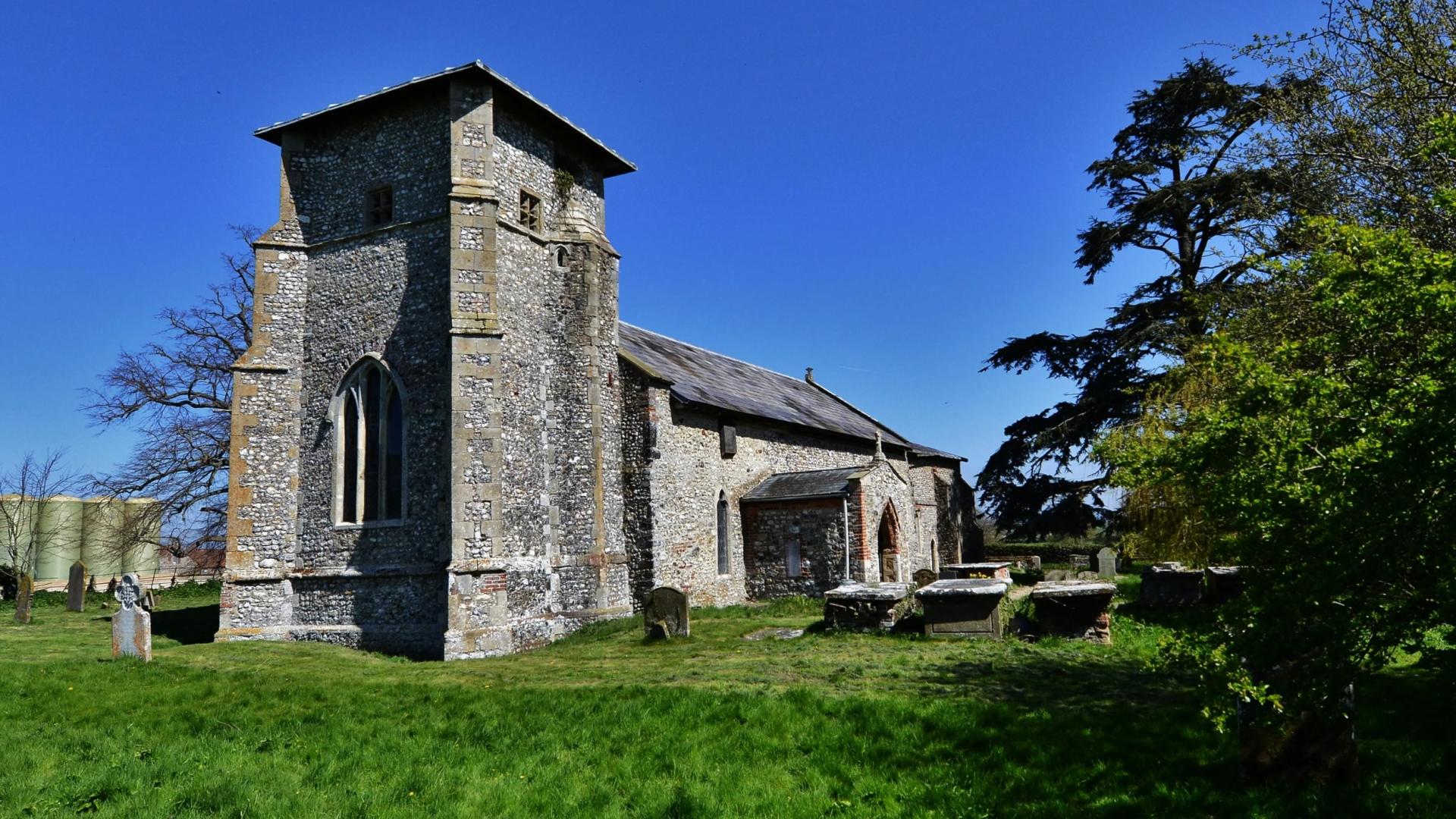 A unique 14th century grey stone church with a distinctive tower.