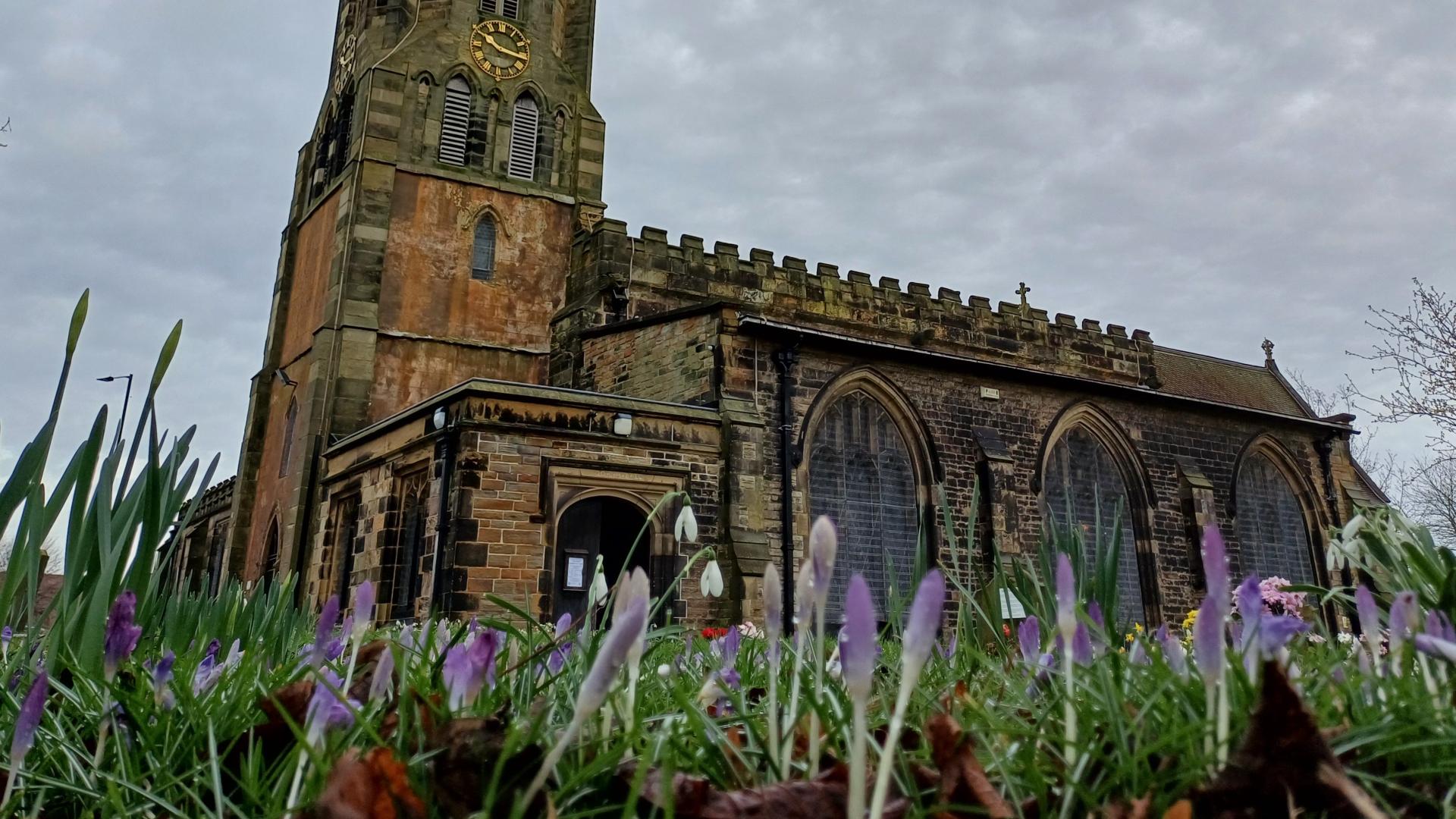 Flowers in the foreground of a church