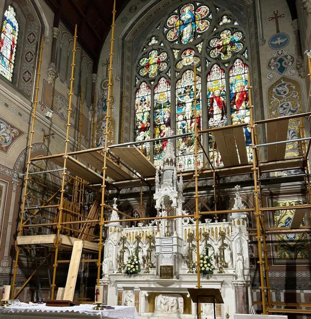 Scaffolding inside the chancel of a church