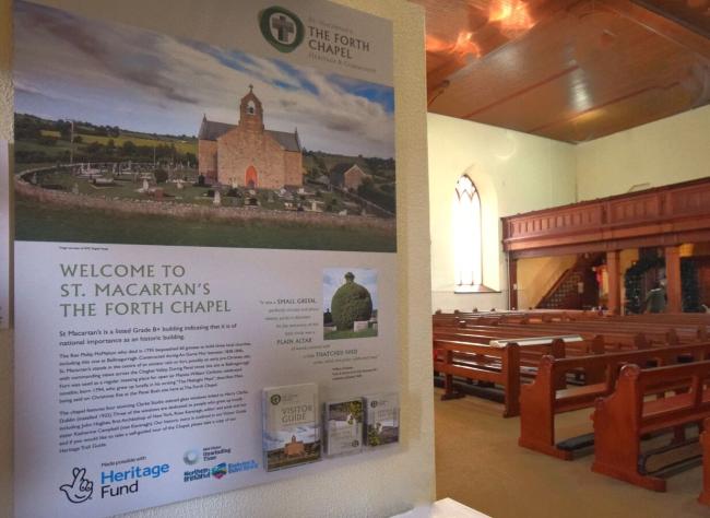 A board with information about the history of a church 