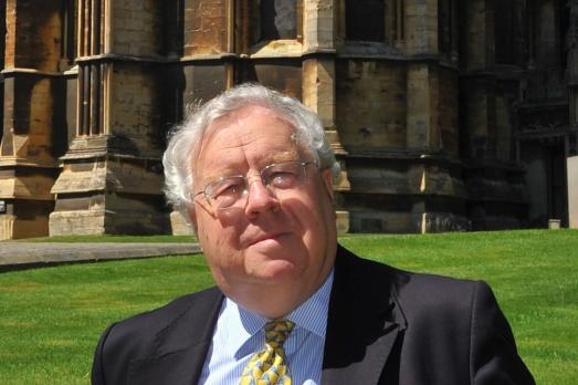Lord Cormack, pictured in front of a historic building