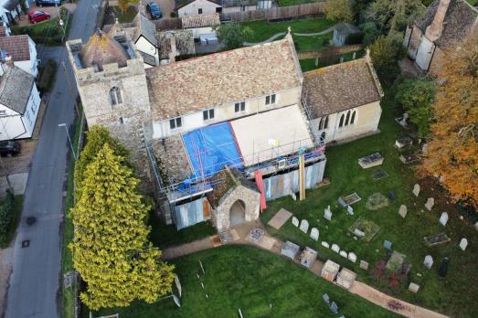 Roof repairs taking place at a historic stone church in Cambridgeshire 