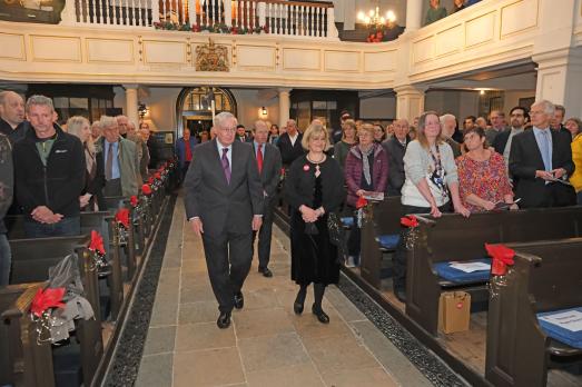The Duke of Gloucester attends the National Churches Trust Carols Service, pictured walking down the central aisle with Chief Executive Claire Walker